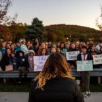 A woman speaks to a crowd during a rally.