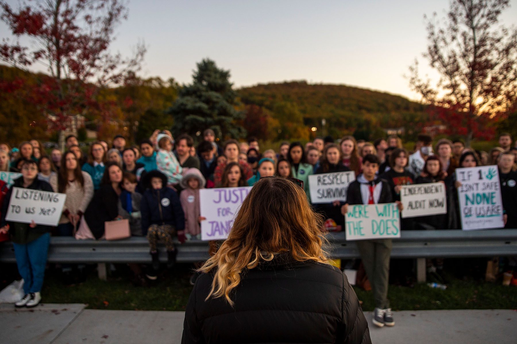 A woman speaks to a crowd during a rally.