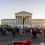 Protesters demonstrate in front of the U.S. Supreme Court.