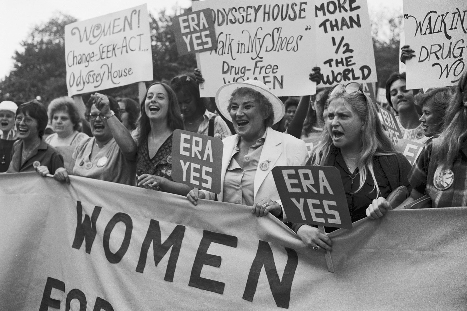 Women carrying signs that read "ERA YES" march in New York City.