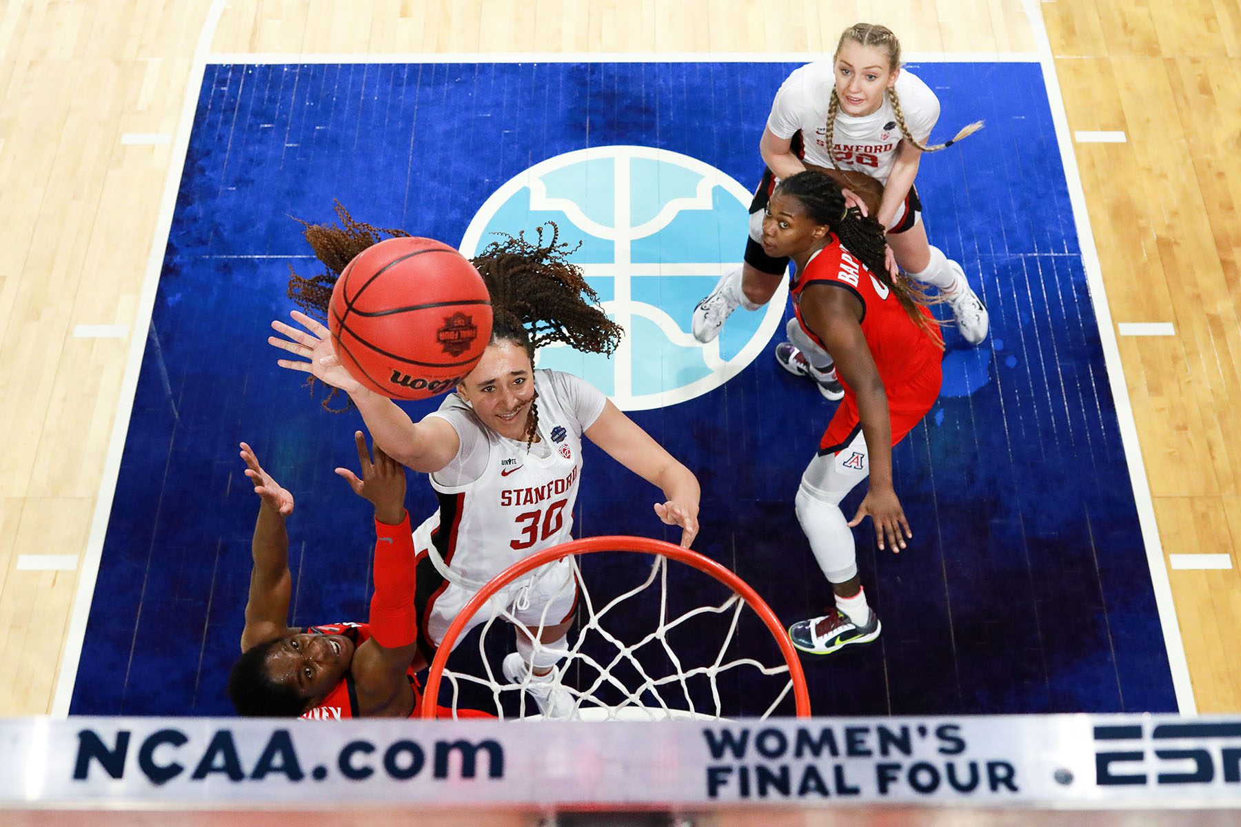 Players on the field at the NCAA Women's Basketball Tournament.