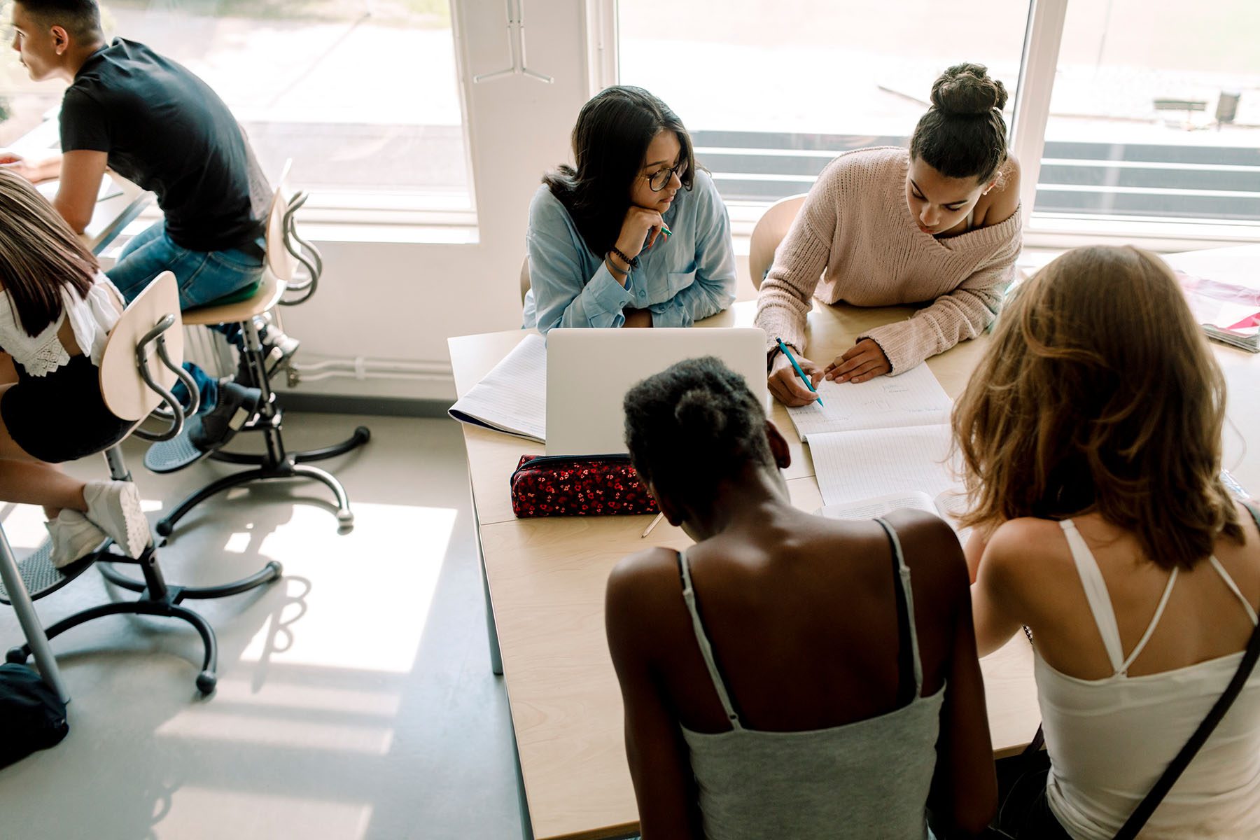 teenage students study in a classroom