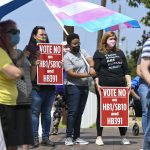 Opponents of several bills targeting transgender youth attend a rally at the Alabama State House.