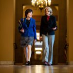 Sen. Susan Collins walks with Sen. Lisa Murkowski on Capitol Hill.