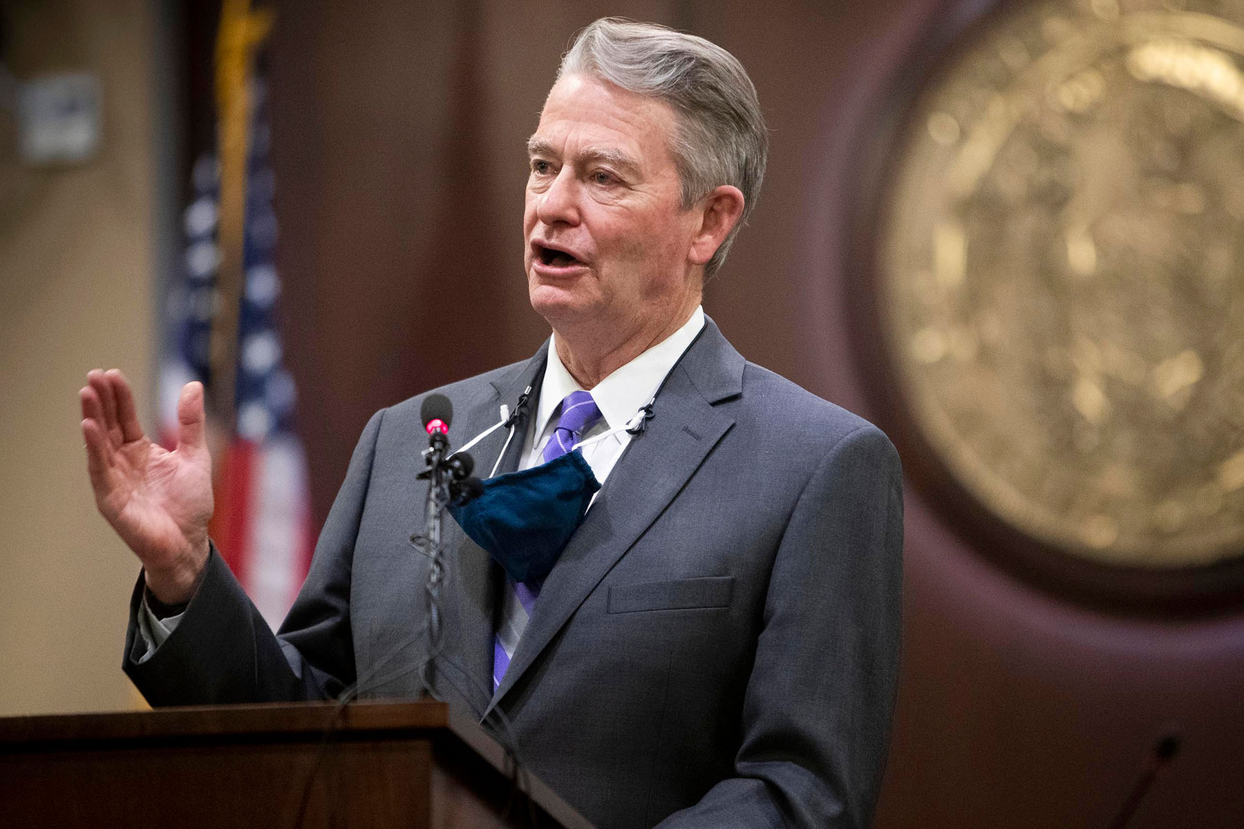 Idaho Governor Brad Little gestures during a press conference.