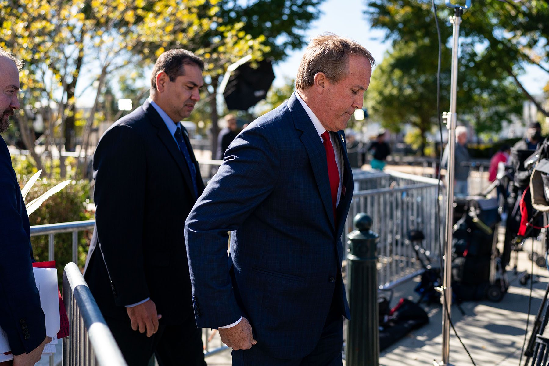 Ken Paxton walks away from the press outside the U.S. Supreme Court.