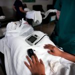 Nurses check women's vitals as they lay down before, or after their abortions.