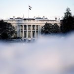 Snow is piled up south of the White House.