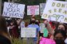 A group of protesters hold signs backing abortion rights.