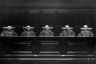 View of a courtroom interior, circa 1890. Five robed judges are shown seated at the bench.