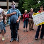 People attend a rally against critical race theory being taught in schools.