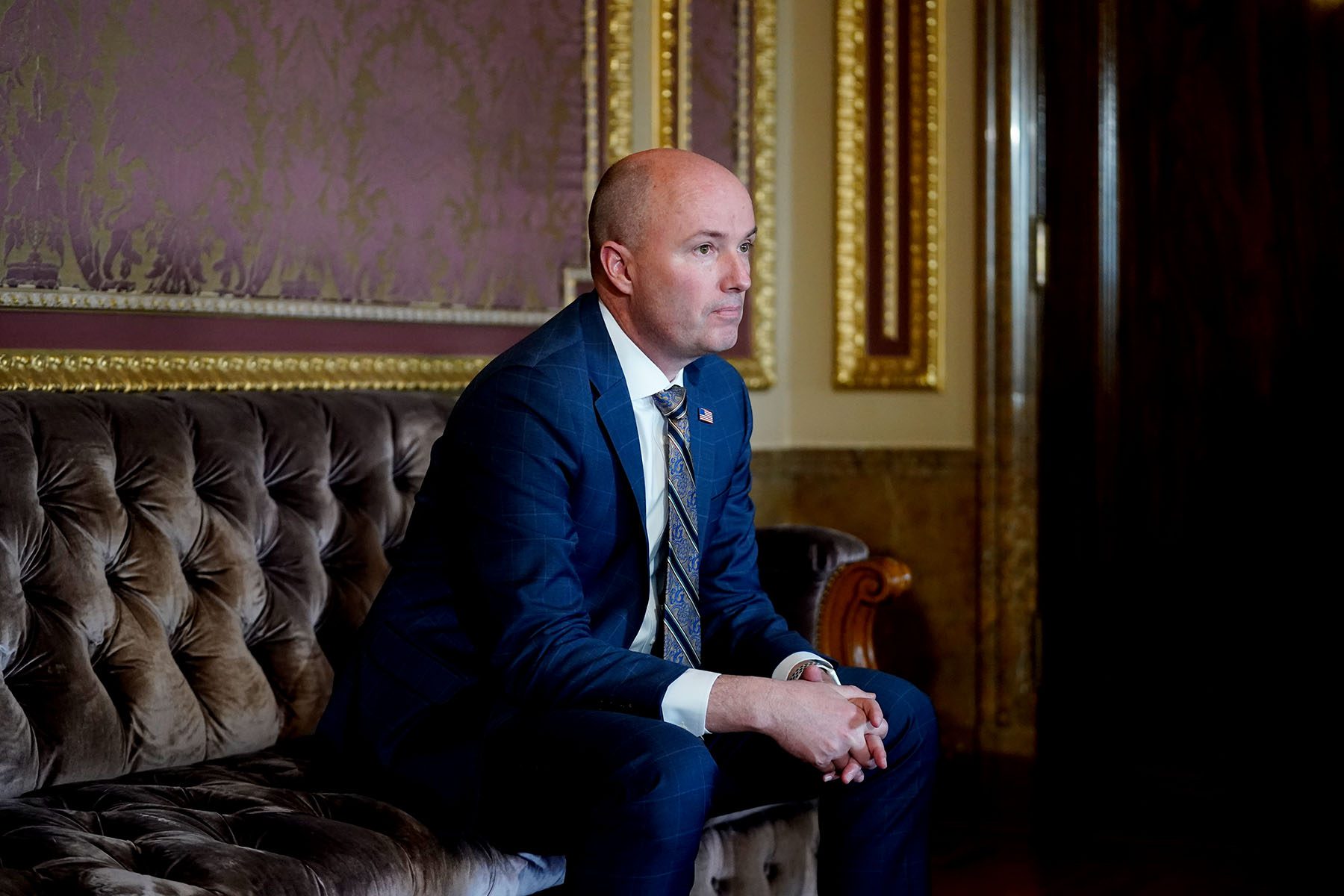 Utah Gov. Spencer Cox looks on at the Utah State Capitol.