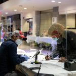 A woman checks into a polling station.