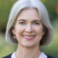 Woman with white hair smiling