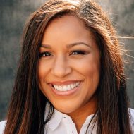 Woman with brown hair smiling