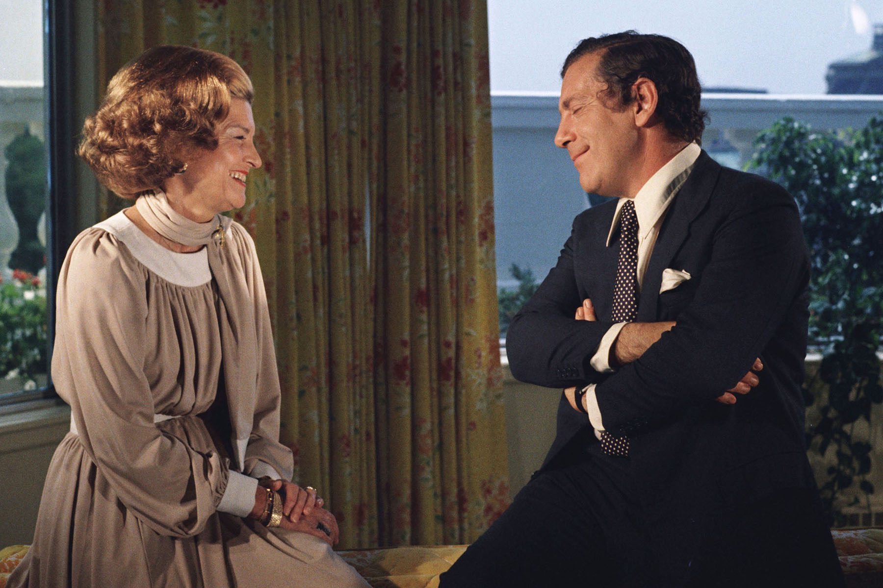 Betty Ford shares a laugh with television journalist Morley Safter.