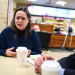 Rep. Lindsay Sabadosa sitting around a table and speaking