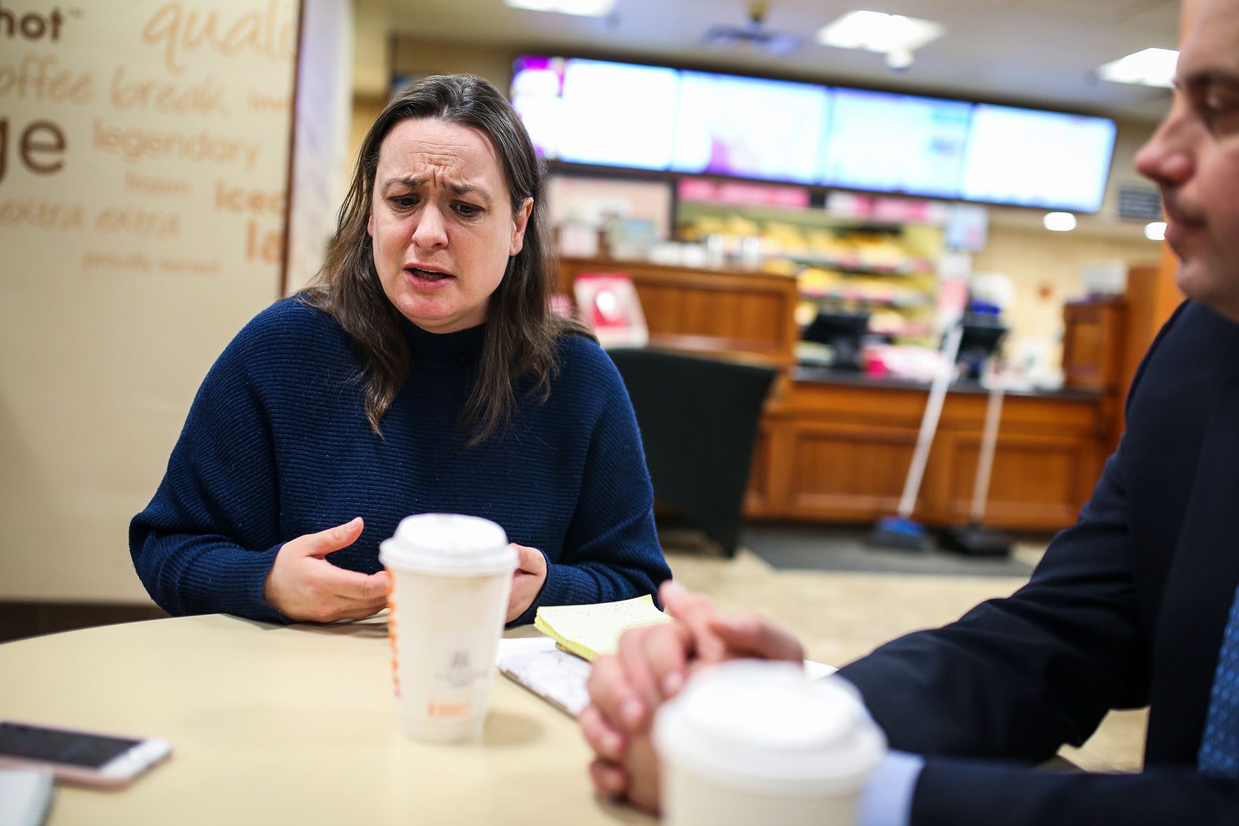 Rep. Lindsay Sabadosa sitting around a table and speaking