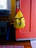 An infant ready emergency feeding kit hangs on a door