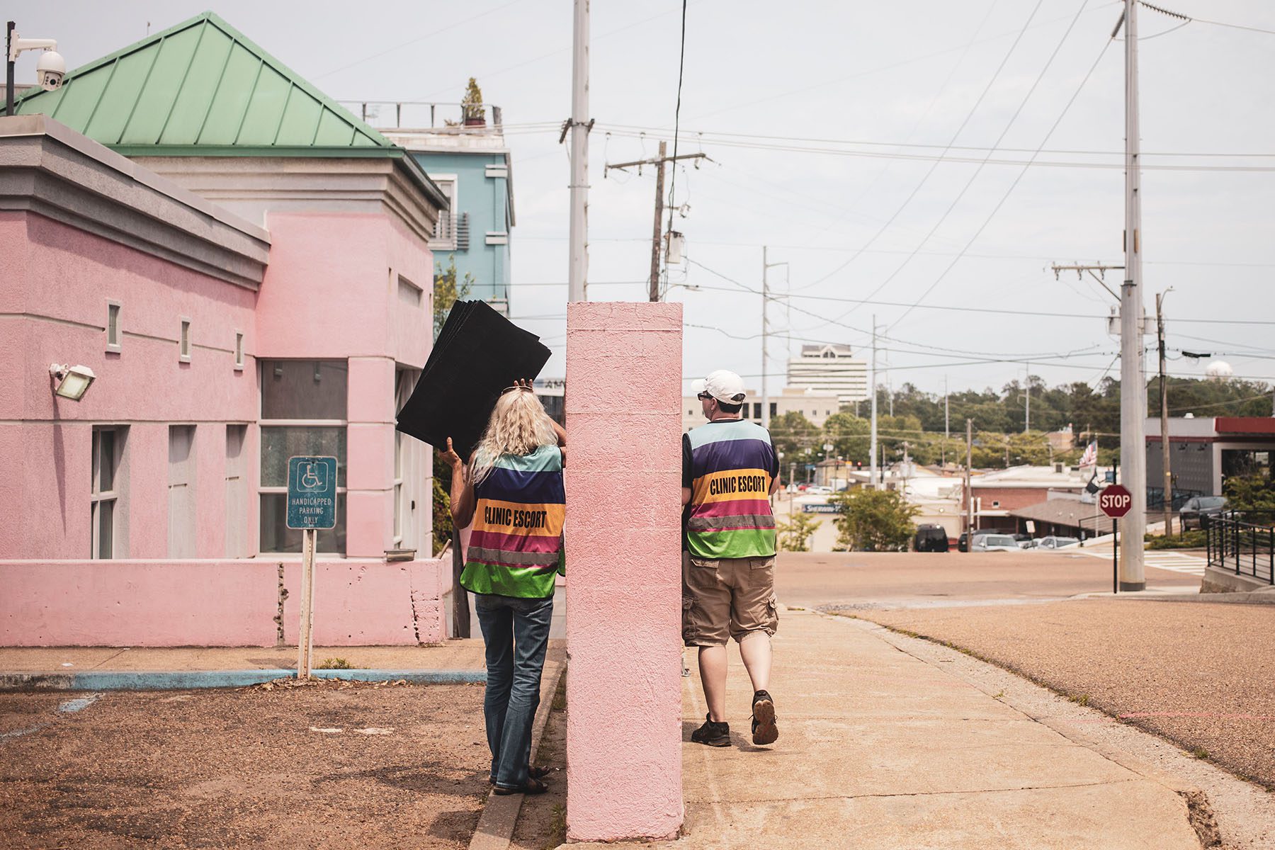 Clinic escorts outside an abortion clinic in Jackson, Mississippi