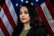 Mayra Flores smiles during a news conference.