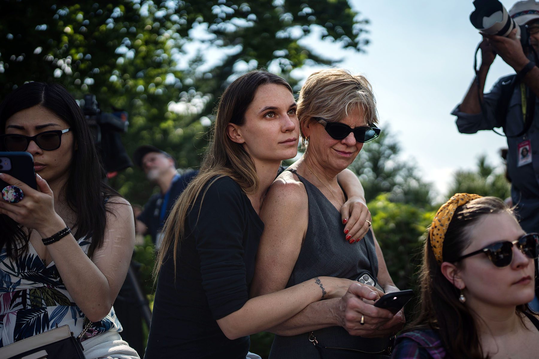 Jessie-Ann Kohlman holds her mother, Lesley Zork in the midst of rally in front of the Supreme Court.