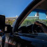 Jailene, 24, stares out her car window after being turned away for abortion services.