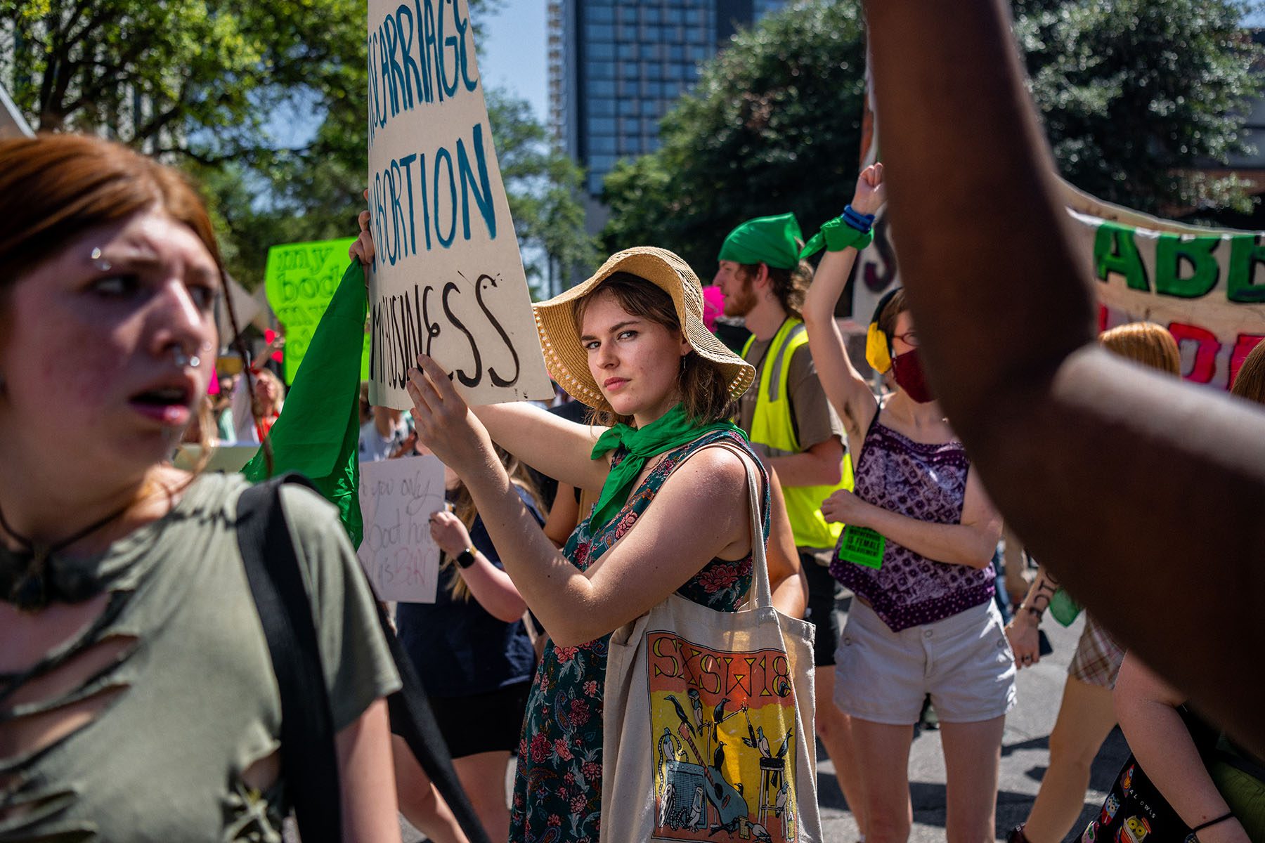 Abortion rights activists march outside of the Austin Convention Center.