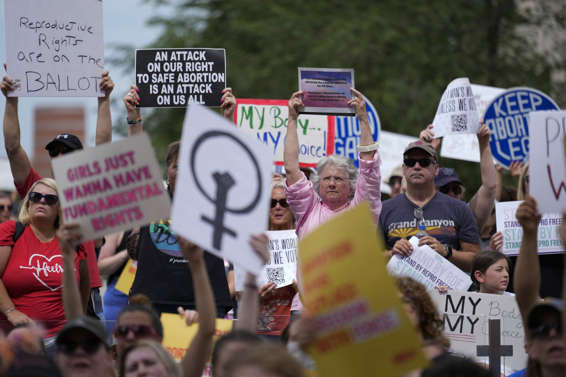 A woman holds a sign at a protest in Indianapolis.