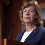 Senator Tammy Baldwin of Wisconsin in a blue suit