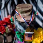 Candles and flowers decorate a makeshift memorial for U.S. Army Specialist Vanessa Guillen.