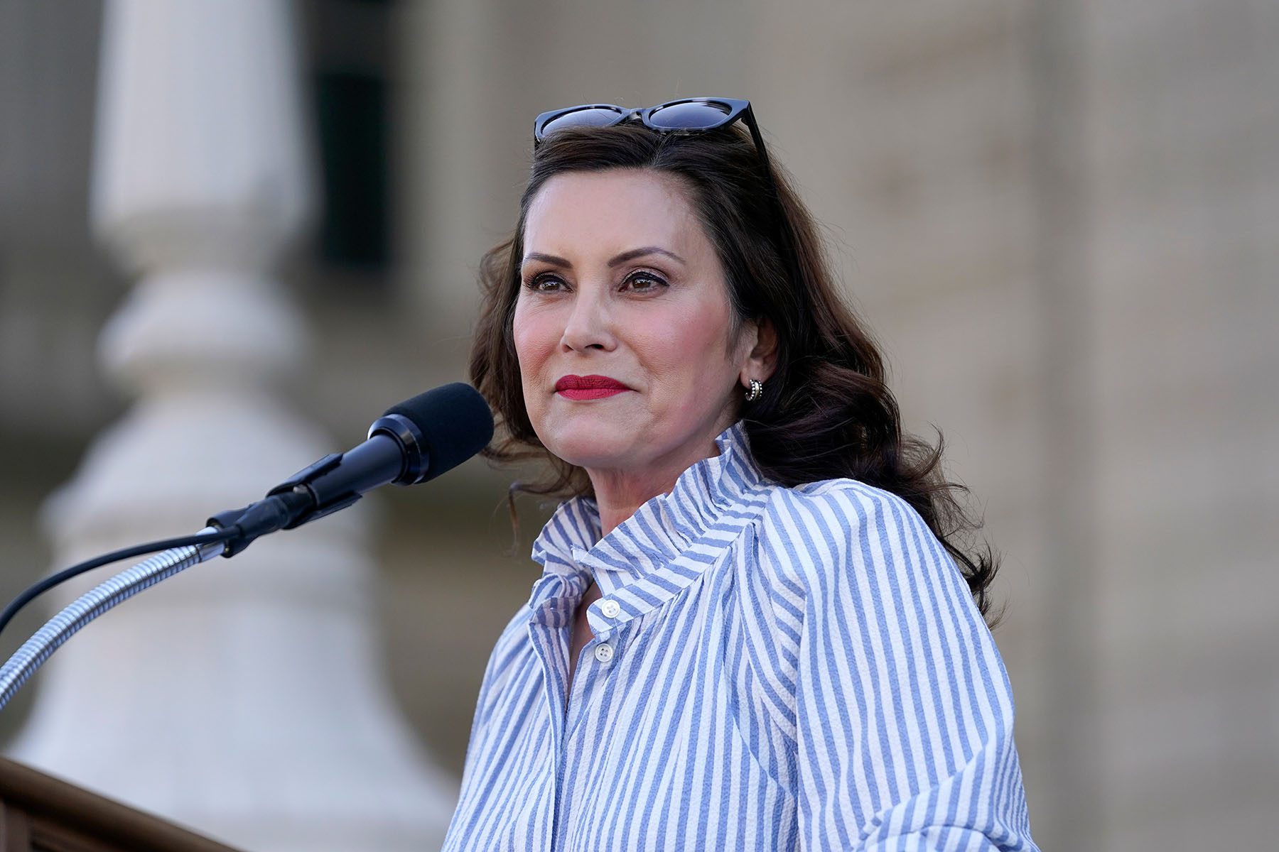 Gov. Gretchen Whitmer speaks to abortion-rights demonstrators utside the Michigan state capitol.