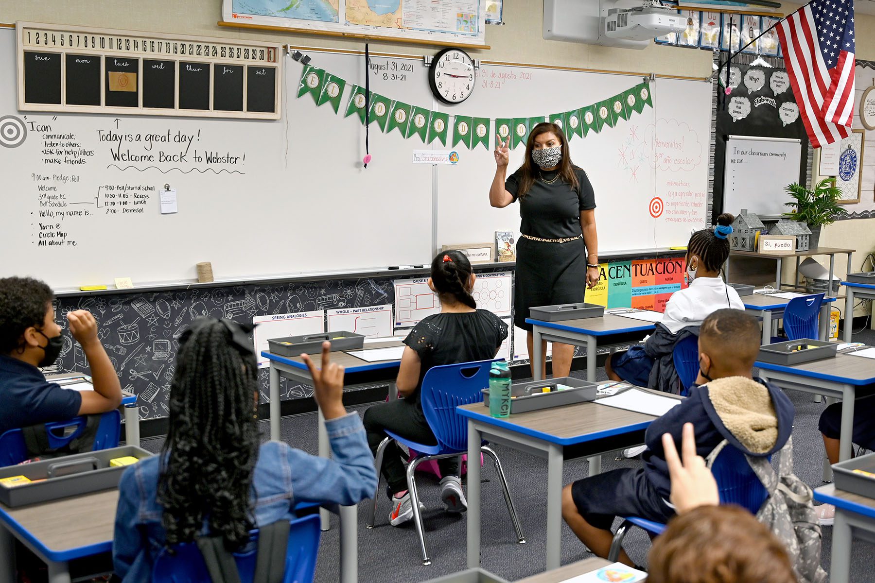 A teacher teaches a third grade class.