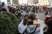 A child hugs their parent as abortion rights activists gather for a demonstration.