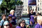 Abortion rights demonstrators gather outside the Michigan State Capitol during a 