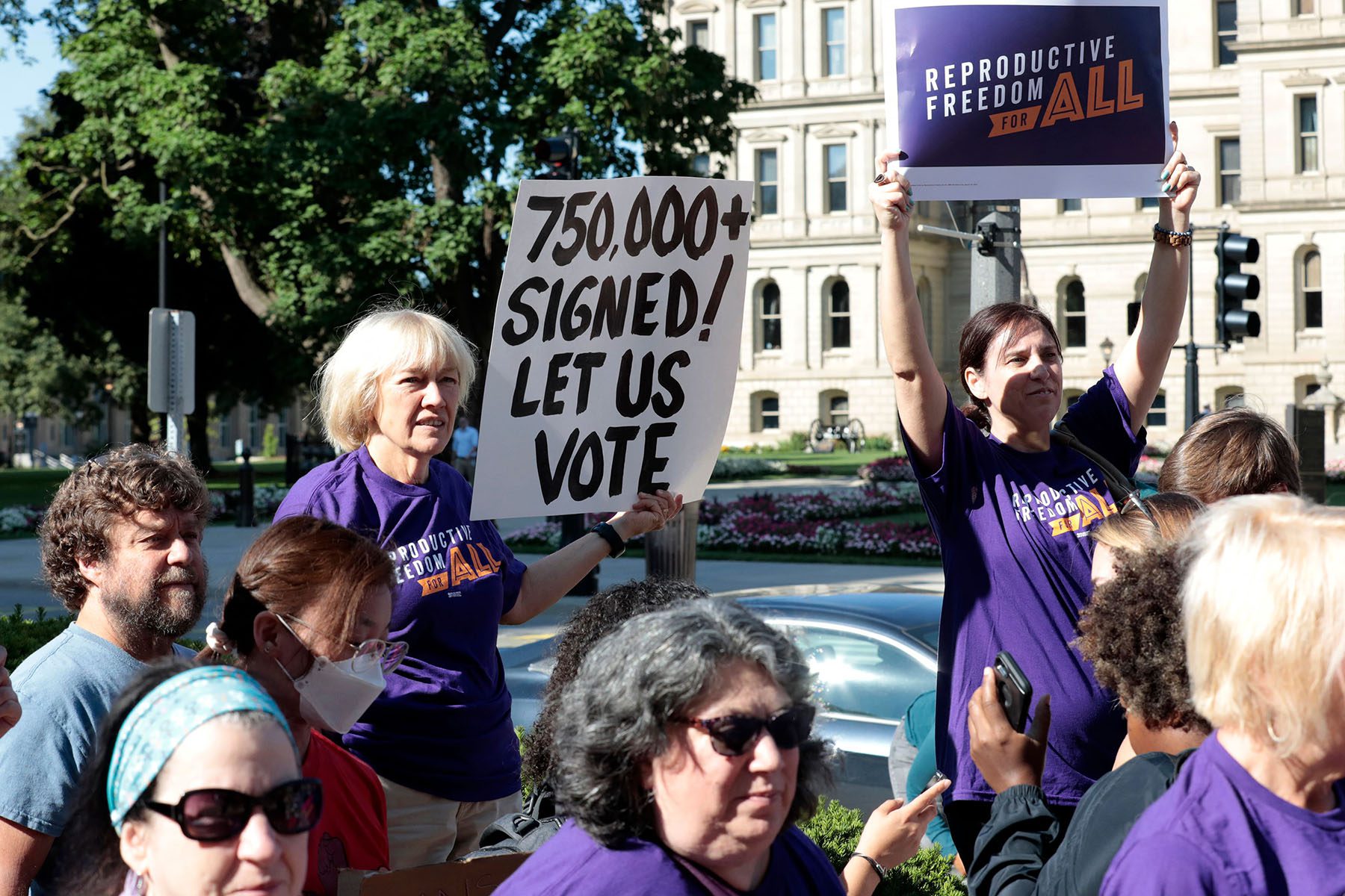 Abortion rights demonstrators gather outside the Michigan State Capitol during a "Restore Roe" rally.