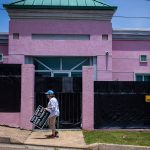 An anti-abortion protestor moves a sign at the Jackson Women's Health Organization.