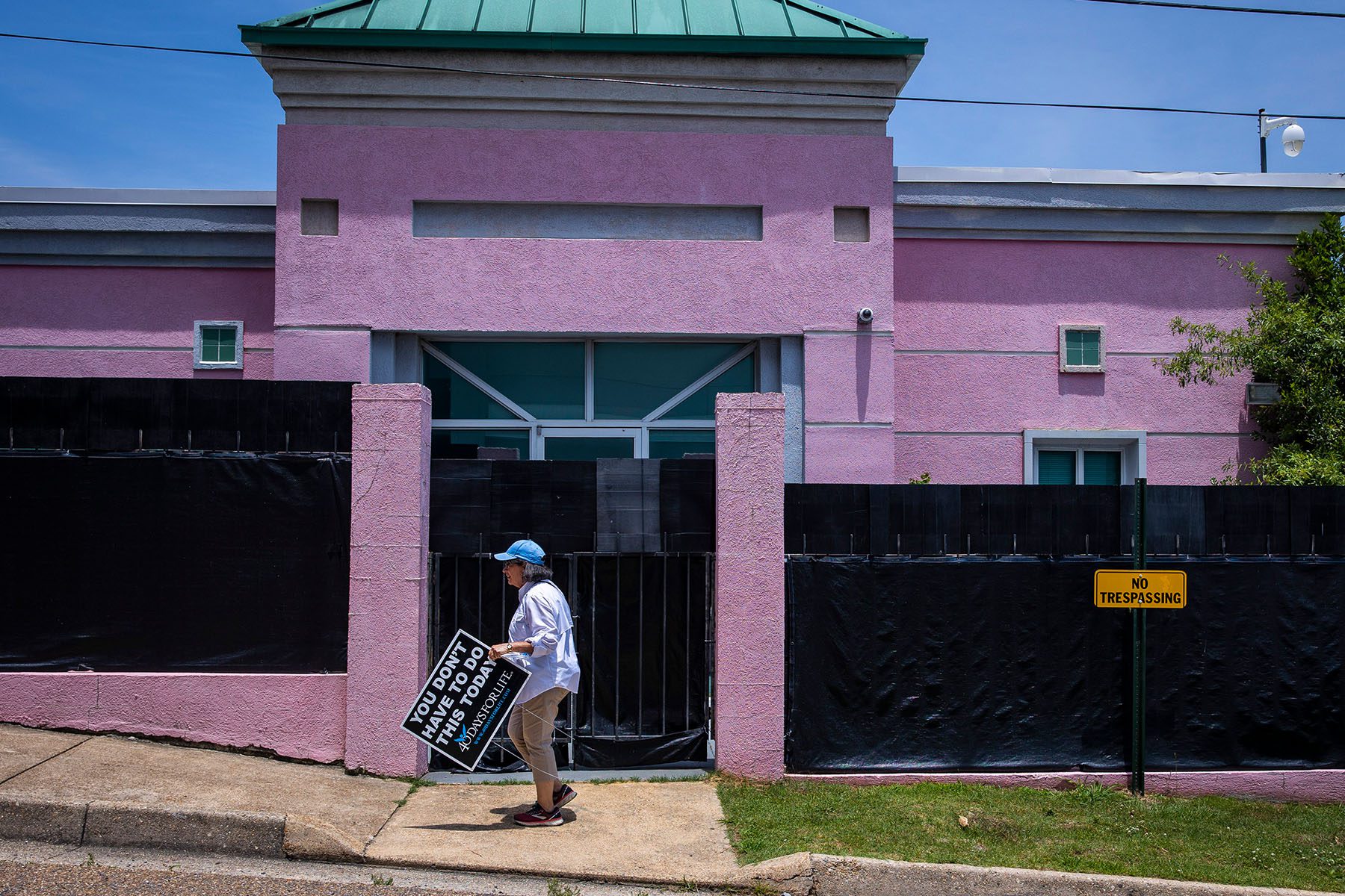 An anti-abortion protestor moves a sign at the Jackson Women's Health Organization.