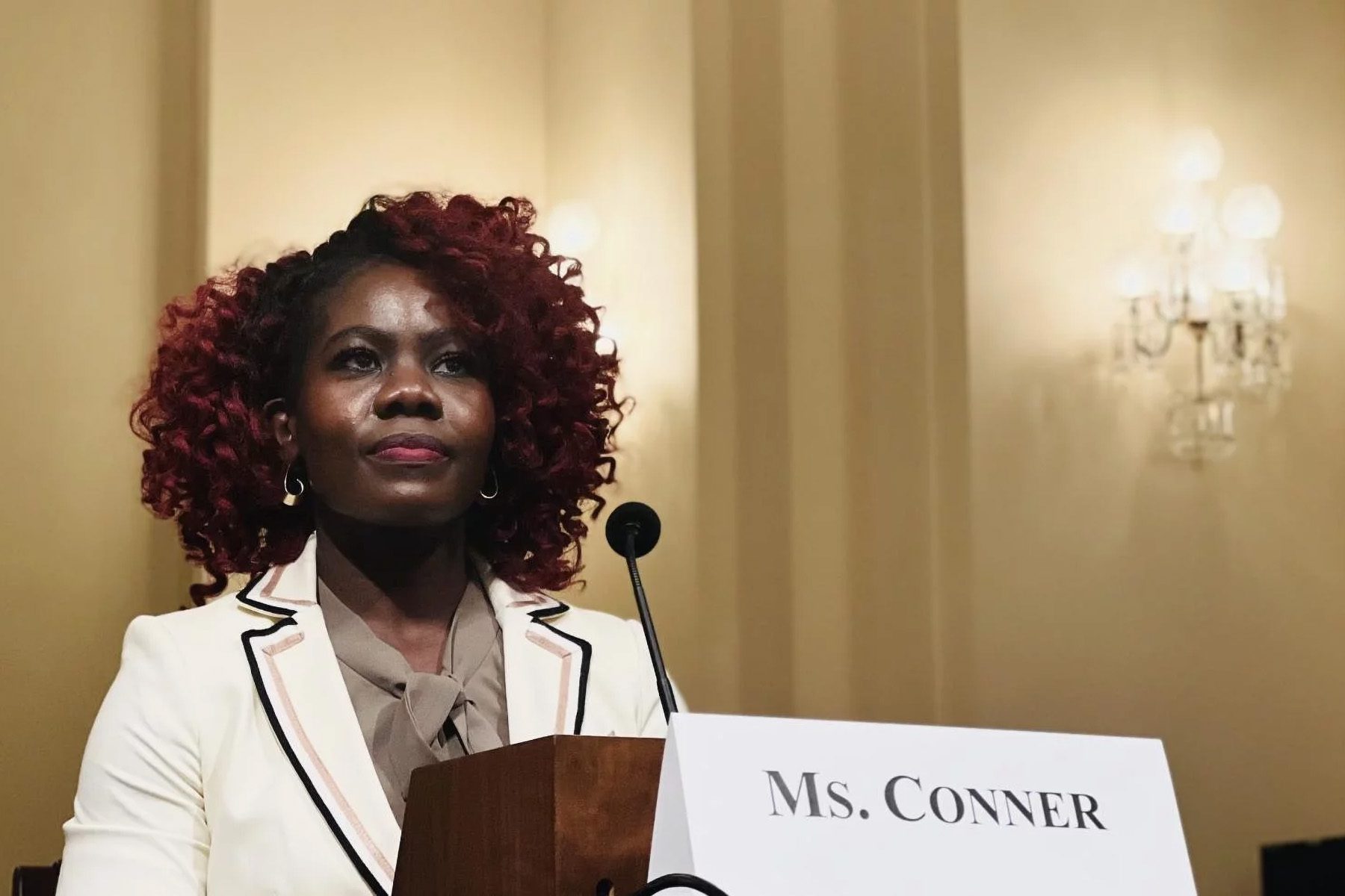 Abre' Conner smiles as she testifies before congress.