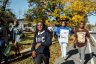 Bennett College students march together to their polling place while chanting and holding signs.