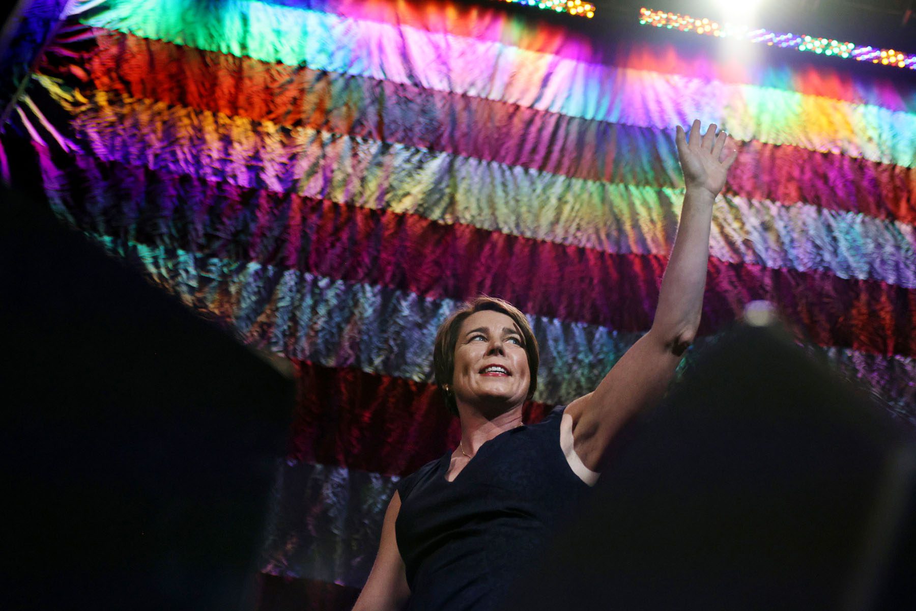 Maura Healey waves after addressing delegates during the State Democratic Party convention.