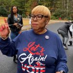 Helen Butler speaks to activists after a voting rights event.