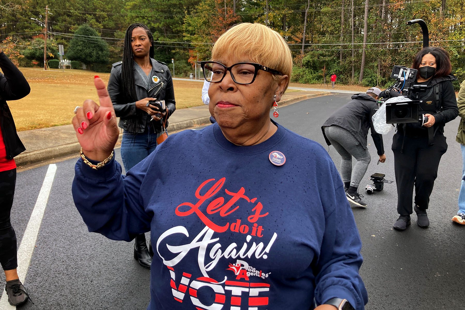 Helen Butler speaks to activists after a voting rights event.