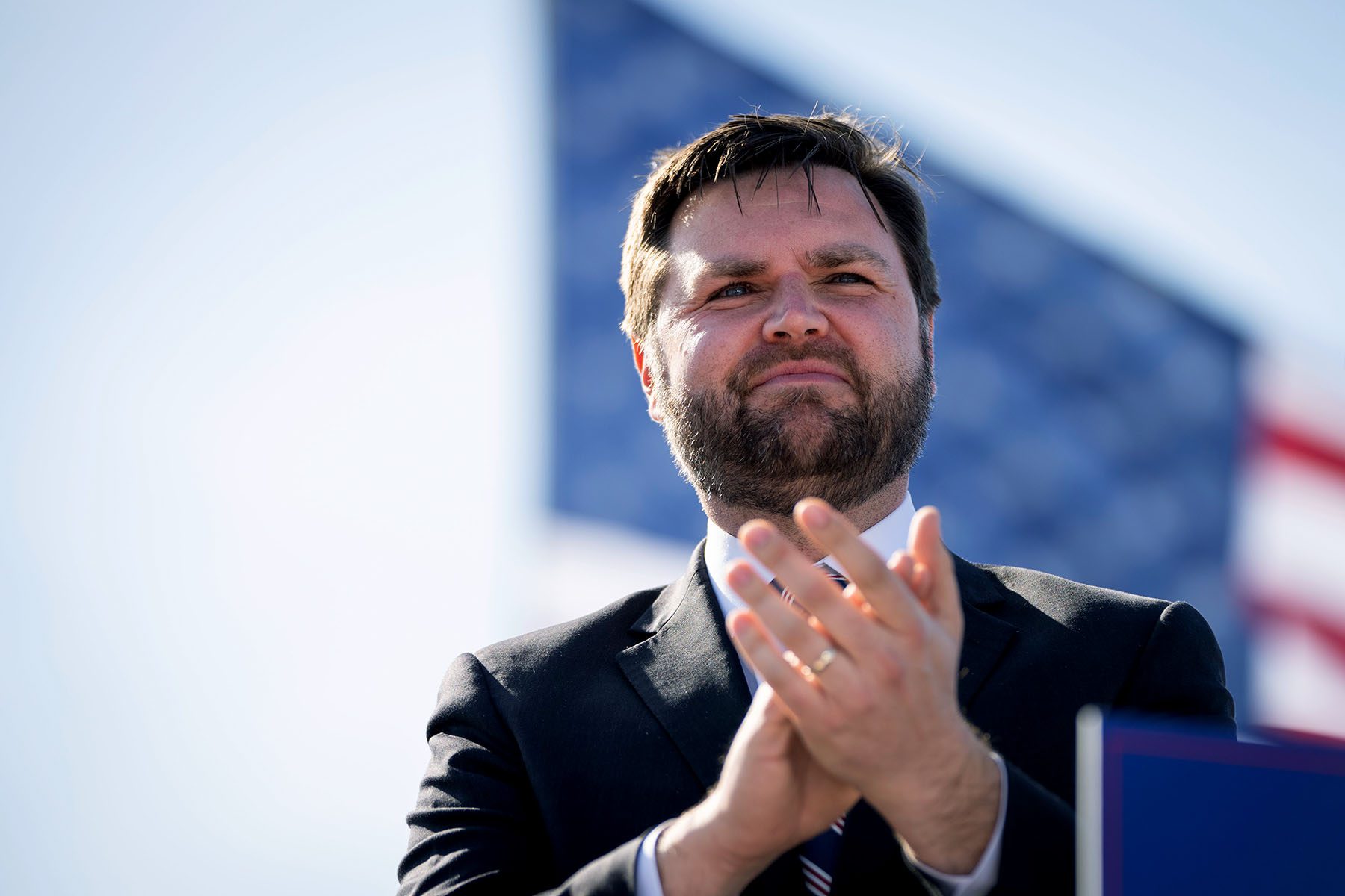 J.D. Vance arrives onstage during a rally hosted by former President Donald Trump.