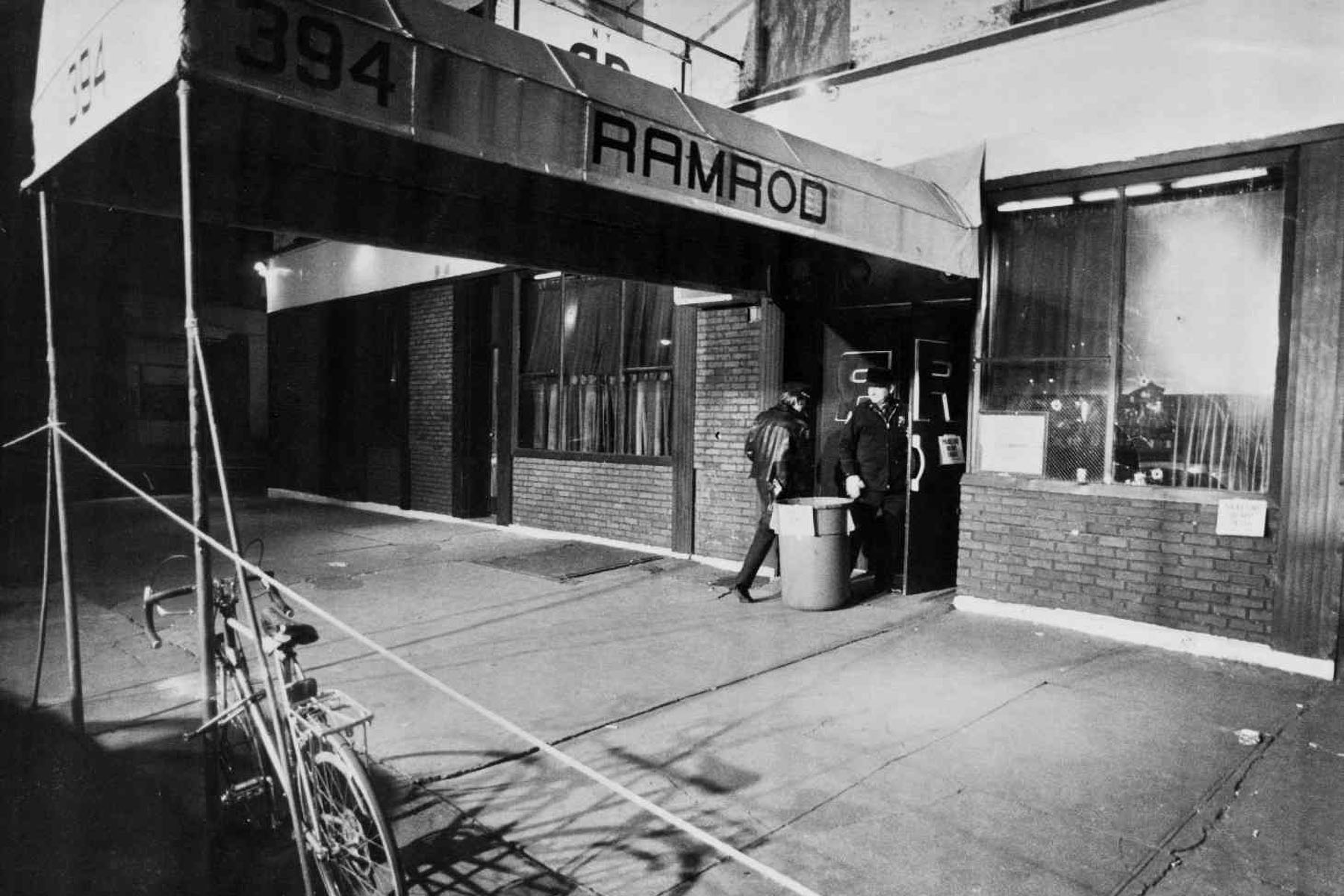 Two people are seen walking into The Ramrod Bar.