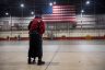 Brittney and Cherelle Griner share a hug in an airport hangar.