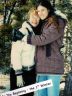 Barbara Goldstein and Ann Willoughby hug each other as they pose for a pictures during their first winter together.