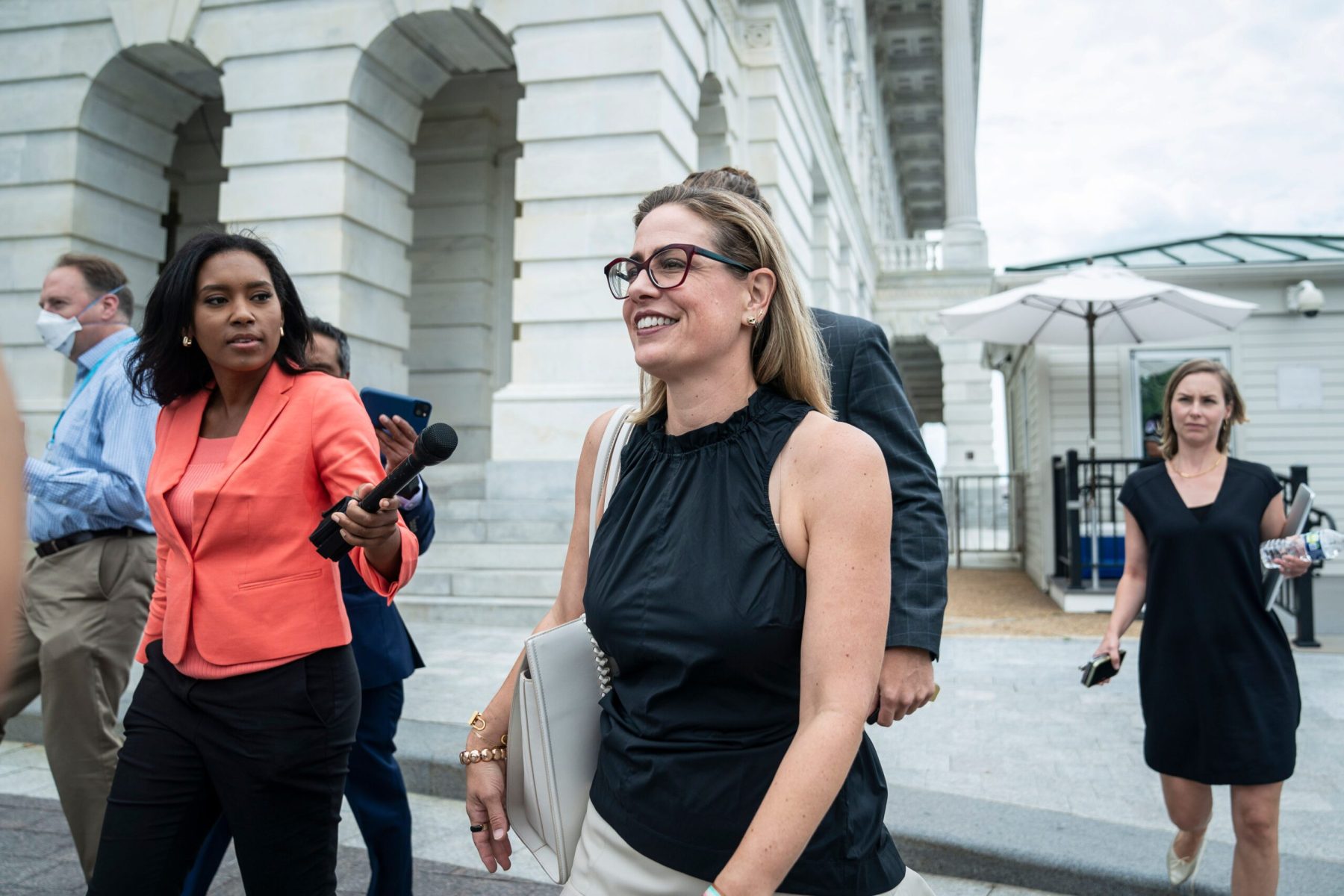 Sen. Kyrsten Sinema departs after a vote on Capitol Hill.