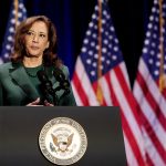 US Vice President Kamala Harris speaks at a podium.