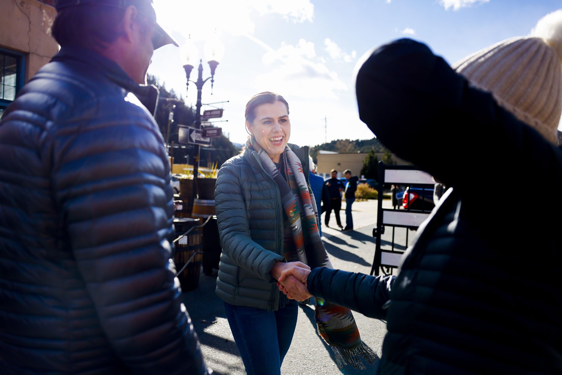 Colorado Secretary of State Jena Griswold smiles and greets supporters before a rally.